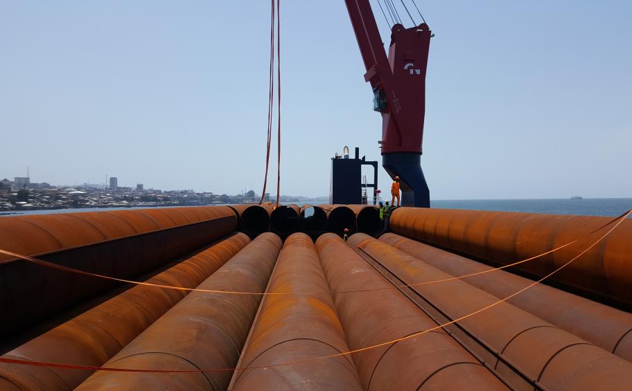 The first piles arrive in Freetown Harbour